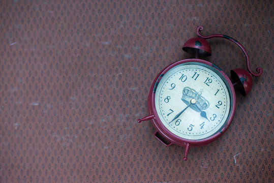 Vintage clock on the vintage background