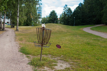 Frisbee disc flying in the air to the target