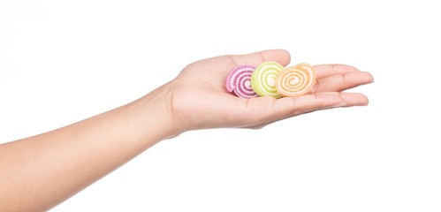 hand holding colorful candy, jellys sweet isolated on white background
