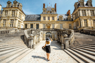 Woman near the Fontainebleau palace in France