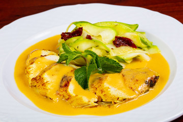 Chicken breast in orange sauce