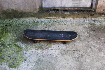 an old skate abandoned by someone near the basement porch.