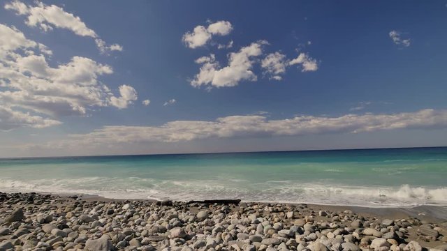 Beautiful waves on sandy beach on Sicili, Italy. Sunny day on the beach.