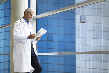 Doctor reading medical reports