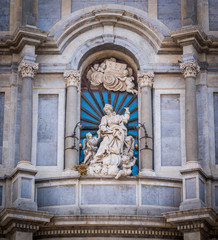 Statue of Saint Agatha on the facade of Catania Duomo. Sicily, Italy.