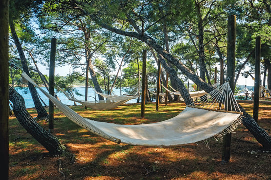 Hammock for camping close-up on the background of the sea and forests on a Sunny day