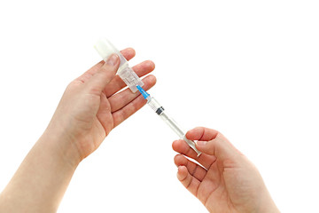 Syringe with ampoule in his hand girl