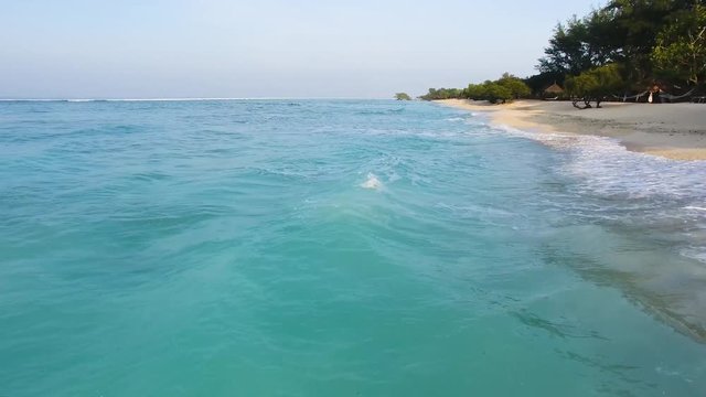 4K Aerial Drone footage up close of amazing turquoise water on white sand beach