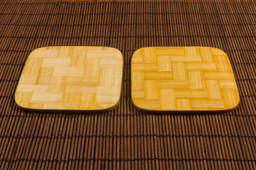bamboo Mat - stand food with bamboo stands for hot, close-up, wooden background