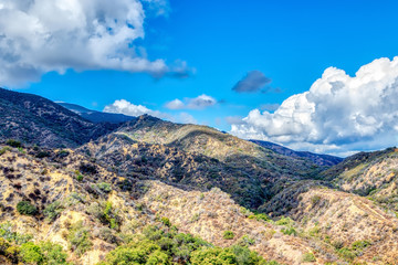Shadows from morning rain clouds over foothills of California mountains