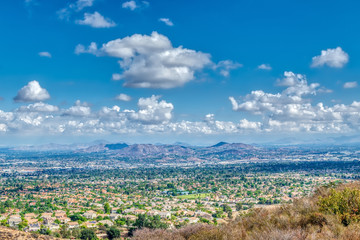 Rain leaves white puffy clouds over inland empire on fall morning
