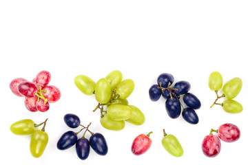 green pink and blue grapes with leaves isolated on the white background with copy space for your text. Top view. Flat lay pattern