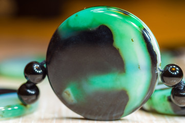 Large polished beads of beautiful translucent green agate gemstone, macro