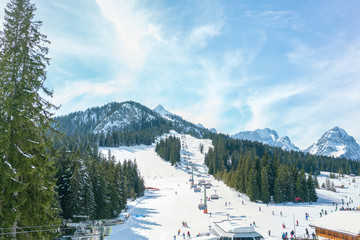 Ski chair lift in the alps of Germany against the blue sky and mountains