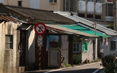 Cottage home with currogated metal roof in downtown old town of Cijin Qijin Island, Kaohsiung City, Taiwan