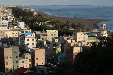 Fototapeta premium View over ocean and beach seaside bay coast of Cijin Qijin Island, Kaohsiung city, Taiwan, Asia