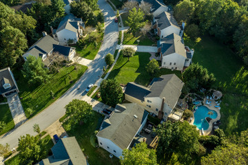 Maryland aerial view of middle class neighborhood with houses and pool