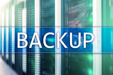 Backup button on modern server room background. Data loss prevention. System recovery.