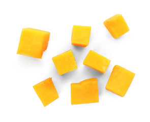 Fresh raw pumpkin pieces isolated on white, top view