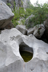 Deep rock pool in the bed of the dry river. National Park, Starigrad-Paklenica, Croatia