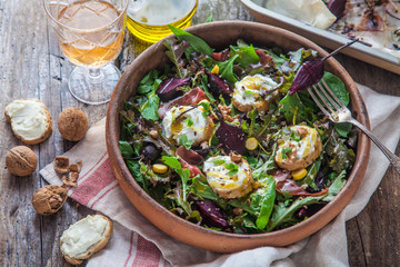 Beet and goat cheese salad in a pot, rustic style