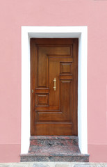 Fototapeta na wymiar Pink facade entrance door