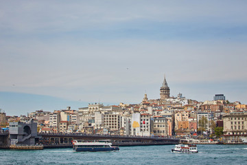 Fototapeta na wymiar A picturesque view of Istanbul and the Galata Tower from the side of the Bay of Bosphorus