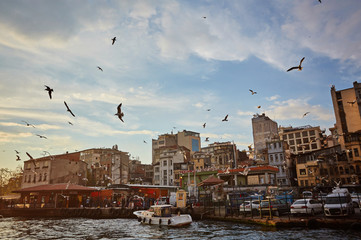 Bosphorus strait with ferry boats on the sunset in Istanbul