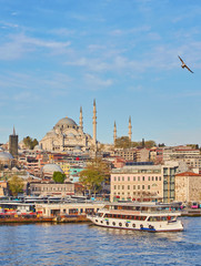 Fototapeta na wymiar Istanbul cityscape with boats and Suleymaniye Mosque