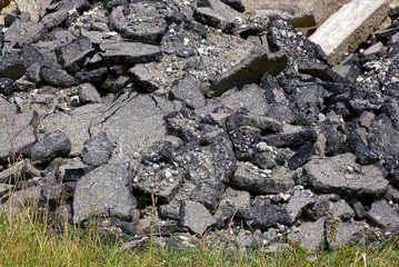 gray texture from pieces of asphalt in a pile of garbage