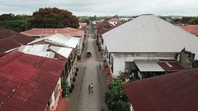 Aerial view of historic buildings in Vigan city, Philippines. Unesco world heritage site. Top down rooftop view. 4k aerial footage. Historic colonial town.