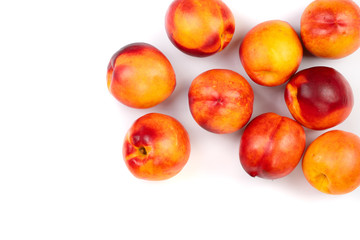 ripe nectarine with leaves isolated on white background with copy space for your text. Top view. Flat lay pattern