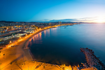 Aerial view of Barcelona Beach in summer night along seaside in Barcelona, Spain. Mediterranean Sea in Spain.