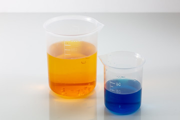 Laboratory glassware with colorful chemical reagent in research laboratory