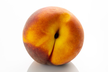Juicy organic peaches on the kitchen table waiting to be eaten