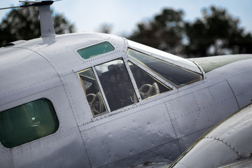 Fototapeta na wymiar Side exterior of cockpit on vintage plane