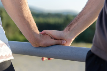 two male hands on each other