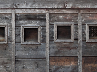 Fototapeta na wymiar old window in the wooden wall