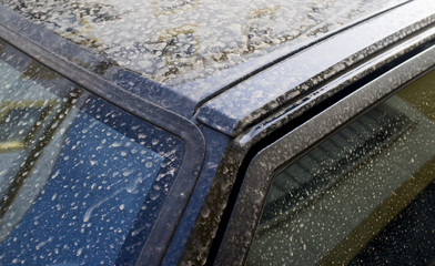 Rain dust drops stains over car exterior