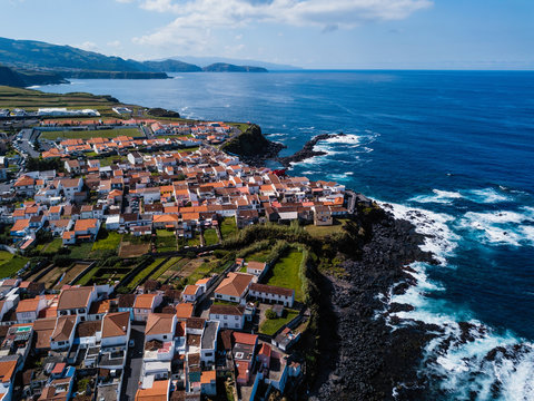 Bird's eye view of the ocean surf on the reefs coast of San Miguel island, Azores, Portugal.