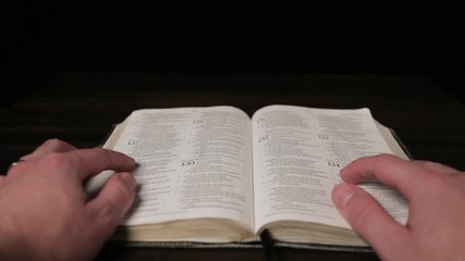 Caucasian Male Hands Reading A Bible
