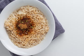noodle in bowl on white background top view