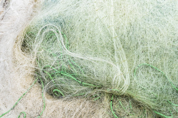 Fishing net textured pattern over the sand in a beach at Cobquecura, Chile, an amazing traditional pattern of the meshing ropes making the fishing net
