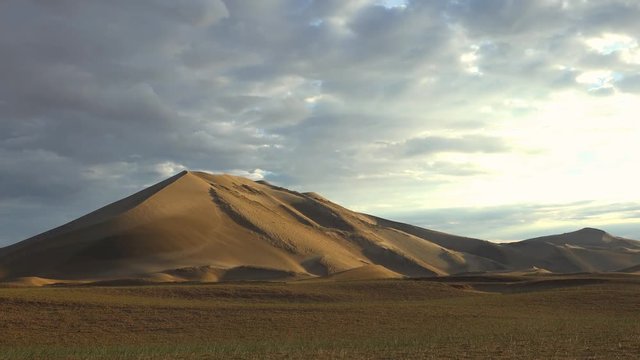 Time-laps video of sunrise over mongolian sand desert