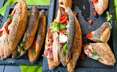 Sandwiches with fresh produce and special bread.