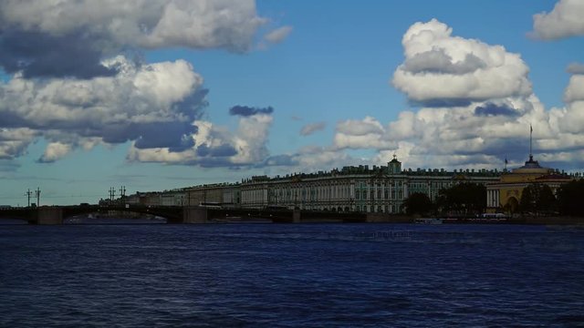 Dramatic cloudy sky over the Neva river in Saint Petersburg, Russia, with the Palace Bridge and Winter Palace - Hermitage Museum, timelapse 4k