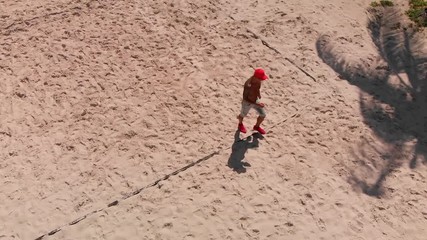 Guy walking in the beach