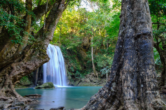 Jungle landscape with flowing blue water of Erawan waterfall with beautiful in the Kanchanaburi Province, Thailand. © chaphot