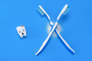 The scared figure of the tooth with the fear of looking at a bunch of white sugar.