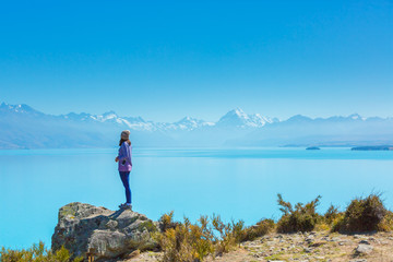 Summertime, Asian woman enjoy travel at lake pukaki as a Mt. Cook Background , South island New Zealand